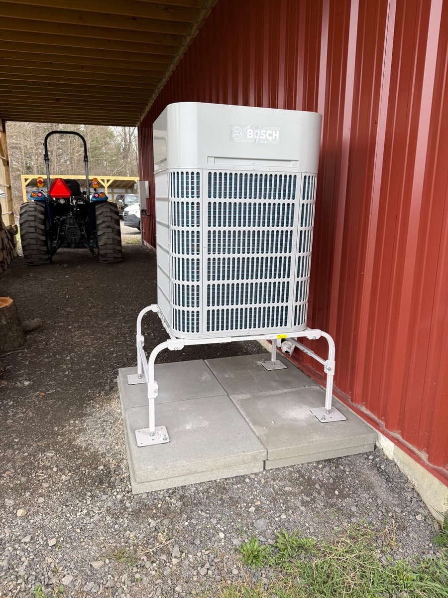IGS Bosch cold-climate heat pump install — Binghamton NY, mounted on steel bracket