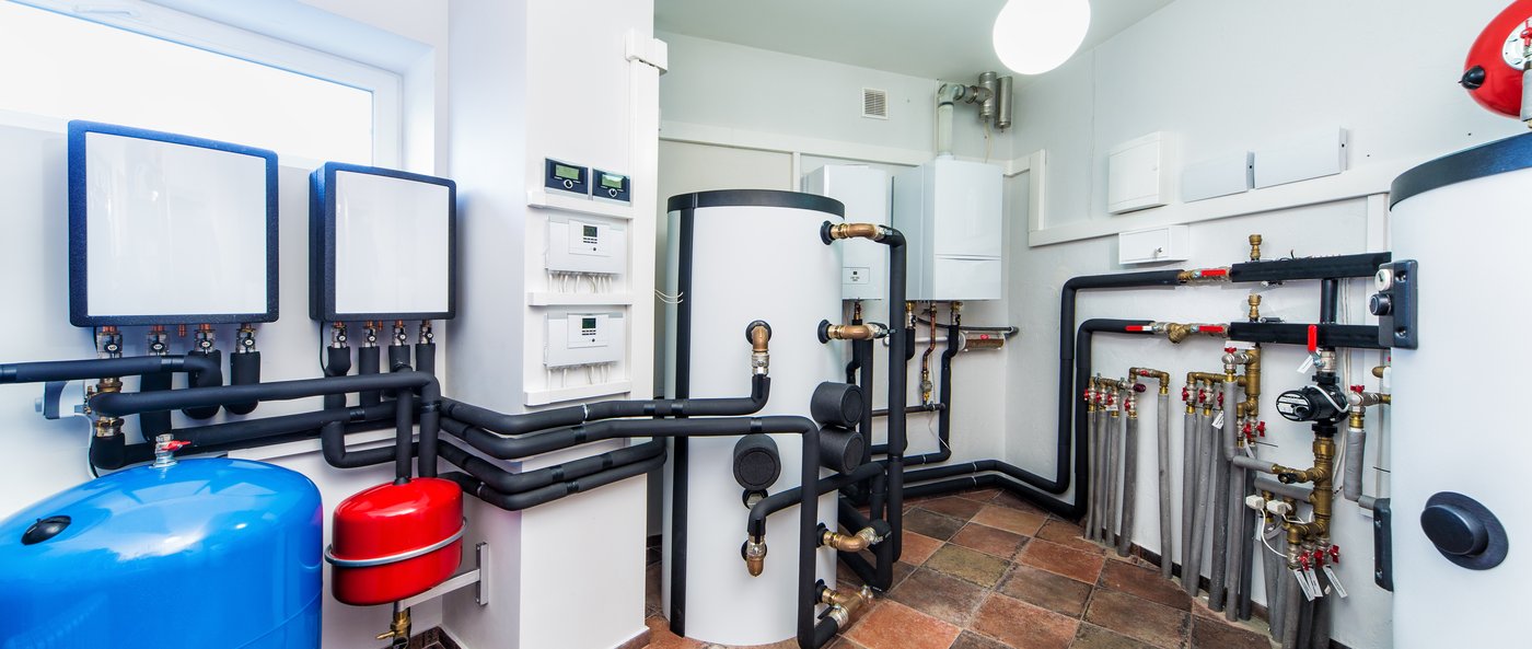 IGS heat pump mechanical room install — right-sized equipment after Manual J load calculation